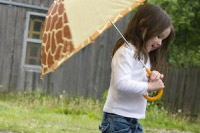 girl with umbrella Don’t Let April Showers Ruin Your Hardwood Floors