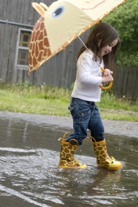 Girl Playing in Rain Picture