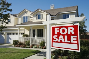 Home with For Sale Sign Photo