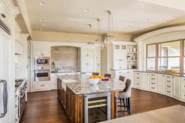 tile floor meeting a hardwood floor in a dining room / kitchen