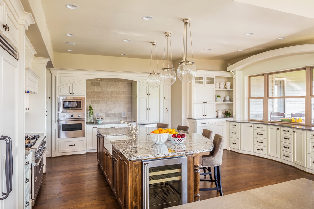 tile floor meeting a hardwood floor in a dining room / kitchen