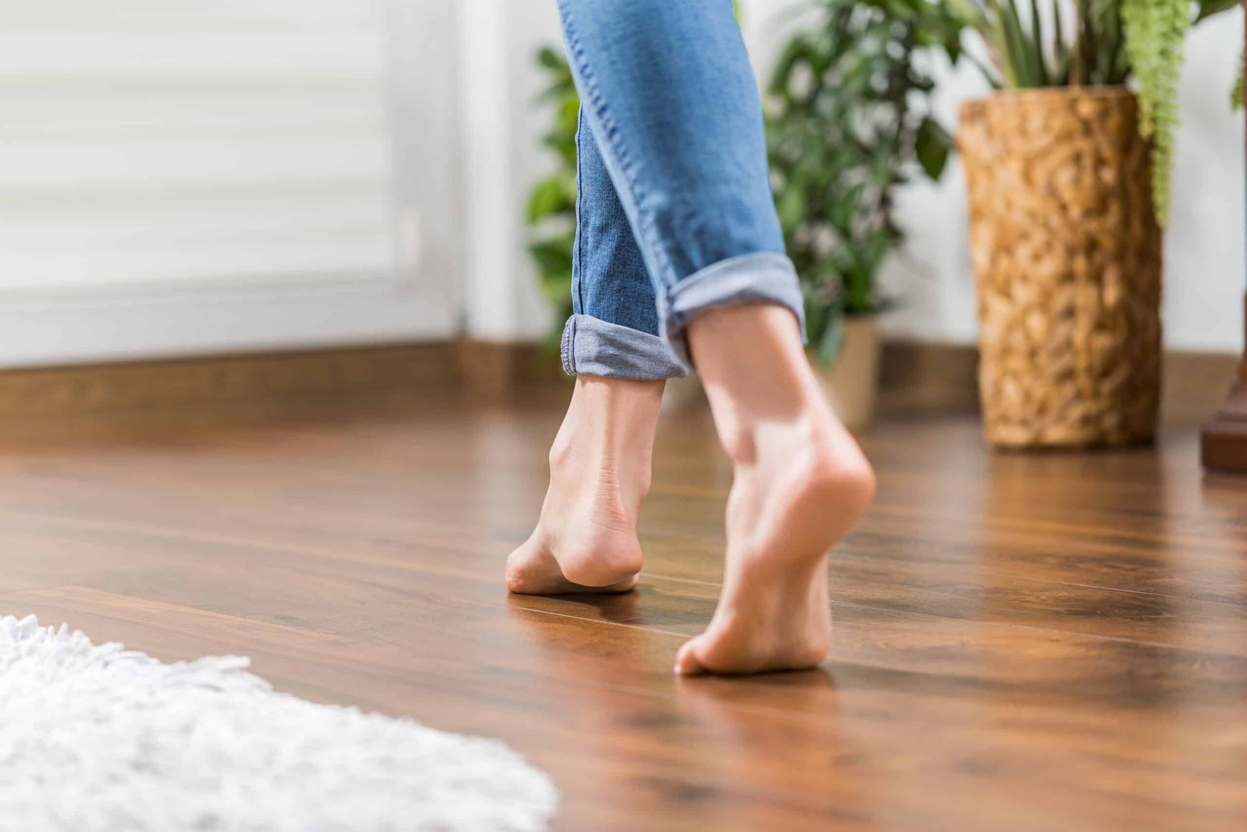 Womans feet walking on new hardwood floor from SVB