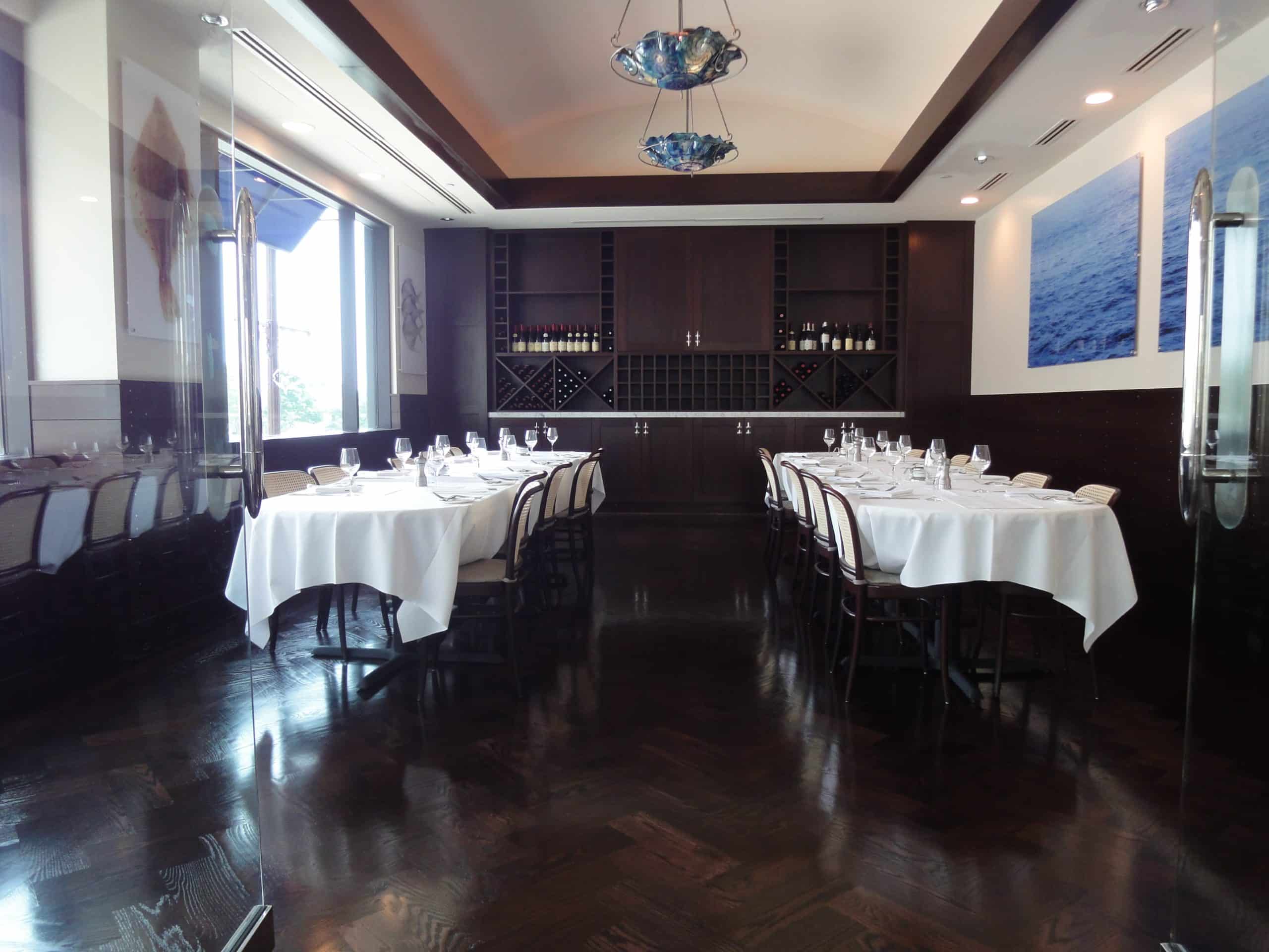 restaurant dining room with dark parquet flooring
