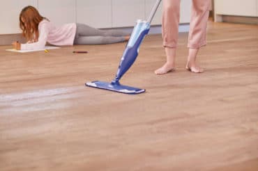 woman cleaning wood floors