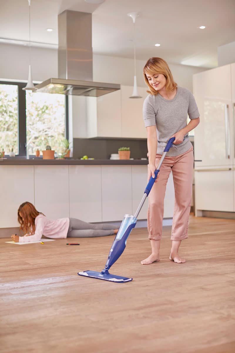 woman cleaning wood floors