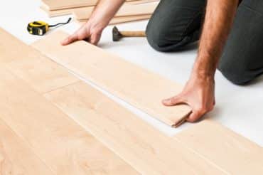 man-installing-hardwood-floor