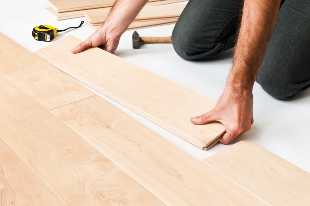 man-installing-hardwood-floor