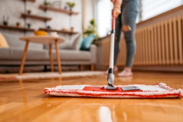 person-cleaning-hardwood