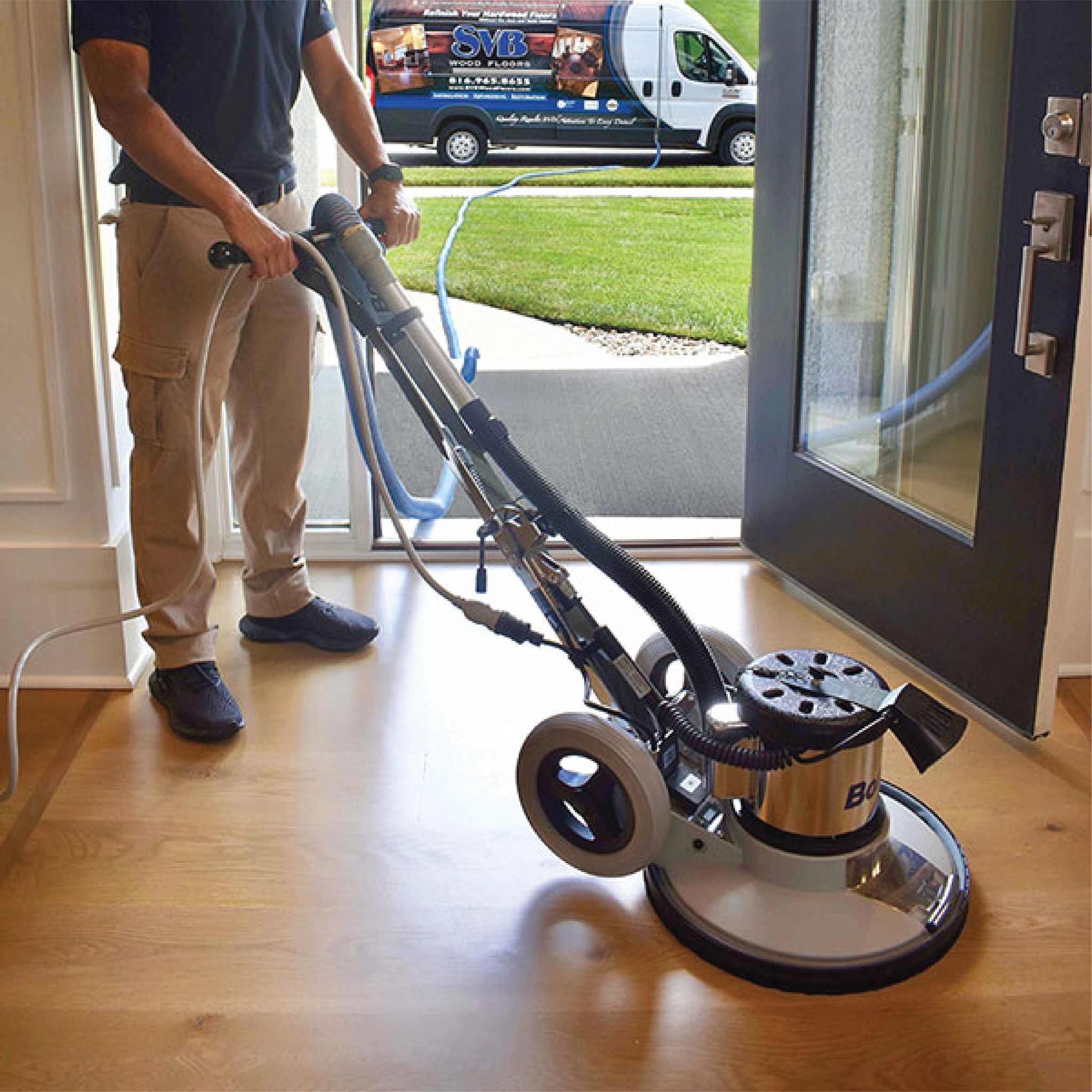 svb contractor doing dustless refinishing on wood floor in entryway of kansas city home