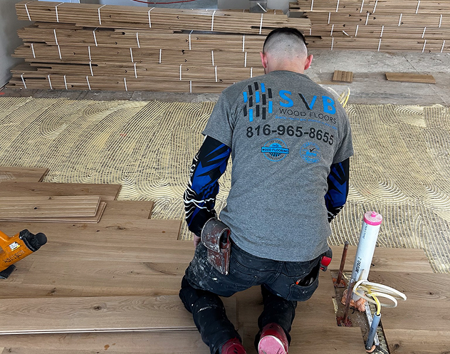 contractor installing a wood floor in a residential home