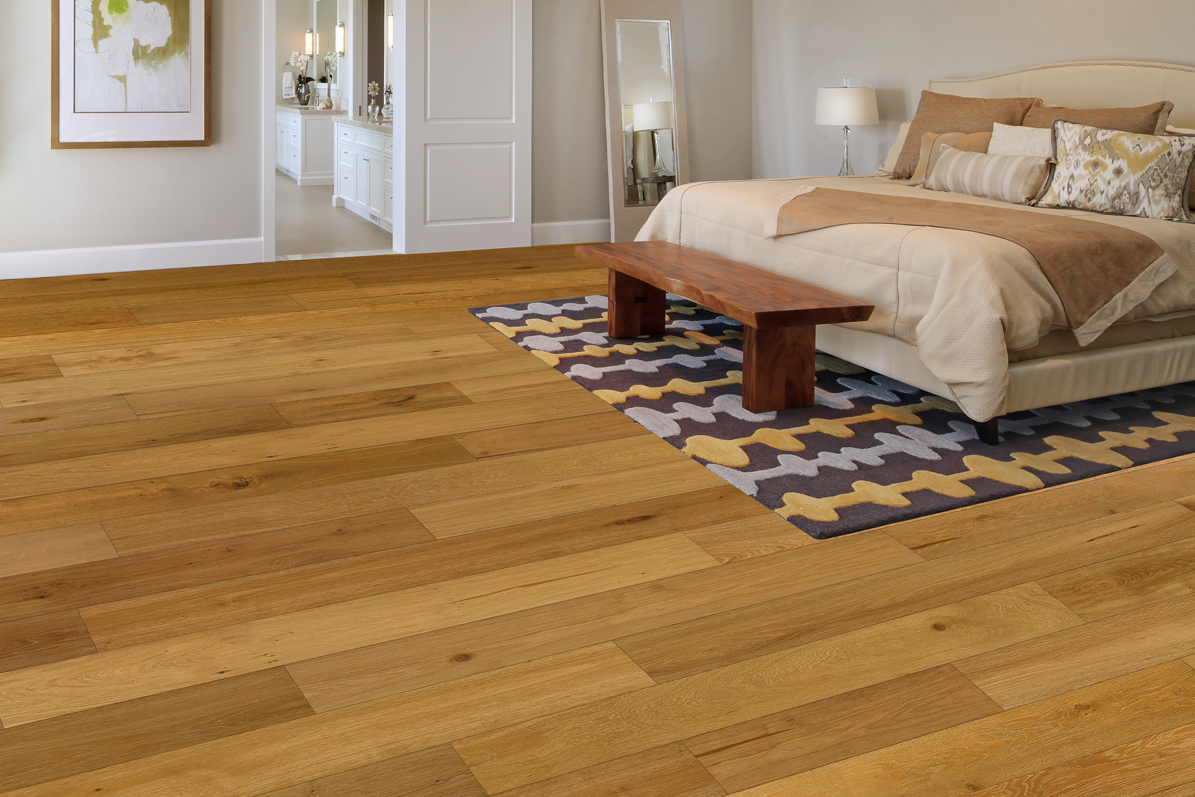 Modern bedroom featuring Foundation pre-finished European Oak hardwood flooring, complemented by a wooden bench and decorative rug.