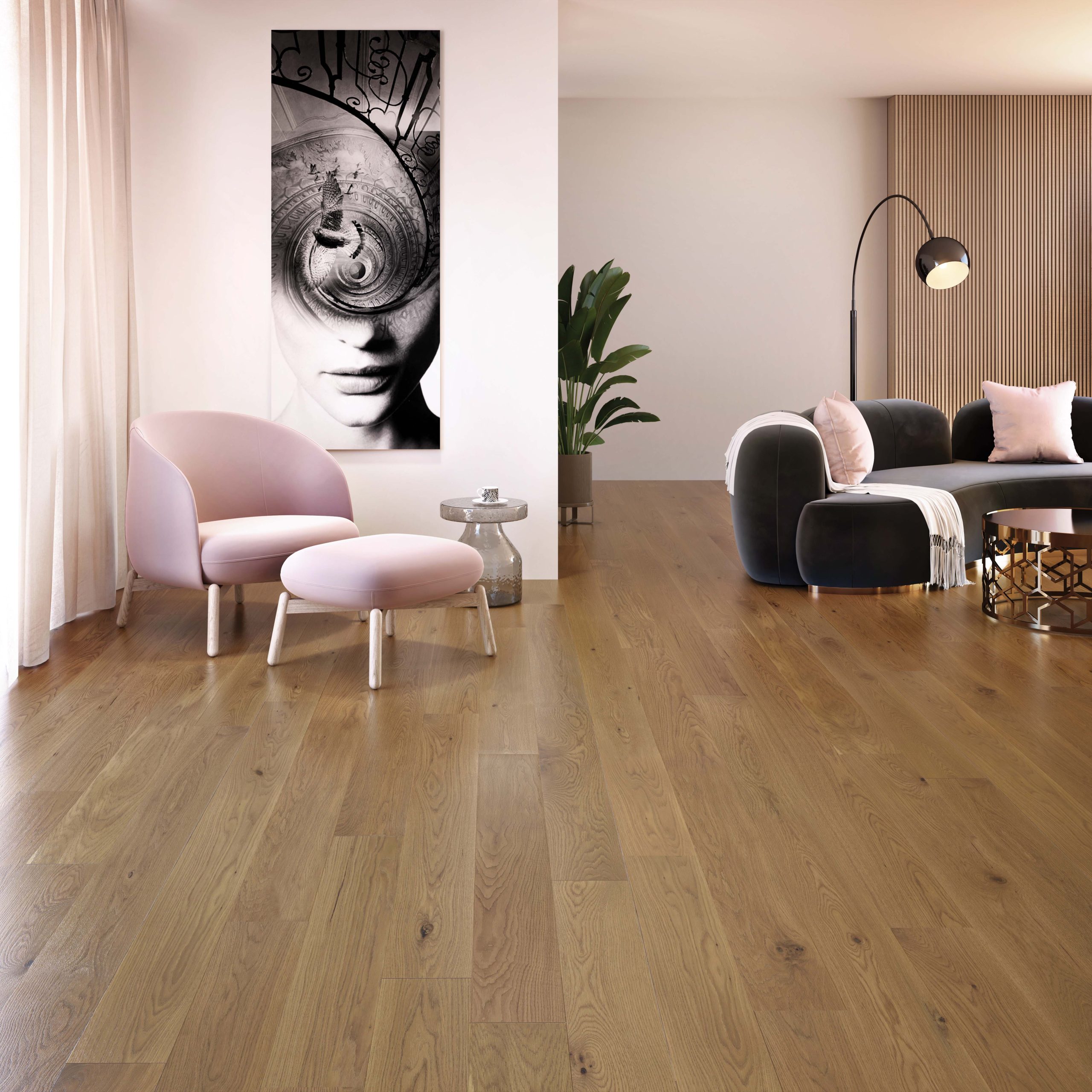 Modern living room featuring Amelia hardwood flooring from the Mirage Muse Collection, with a pink chair and ottoman, dark sofa, and decorative plant, complemented by an artistic wall piece.
