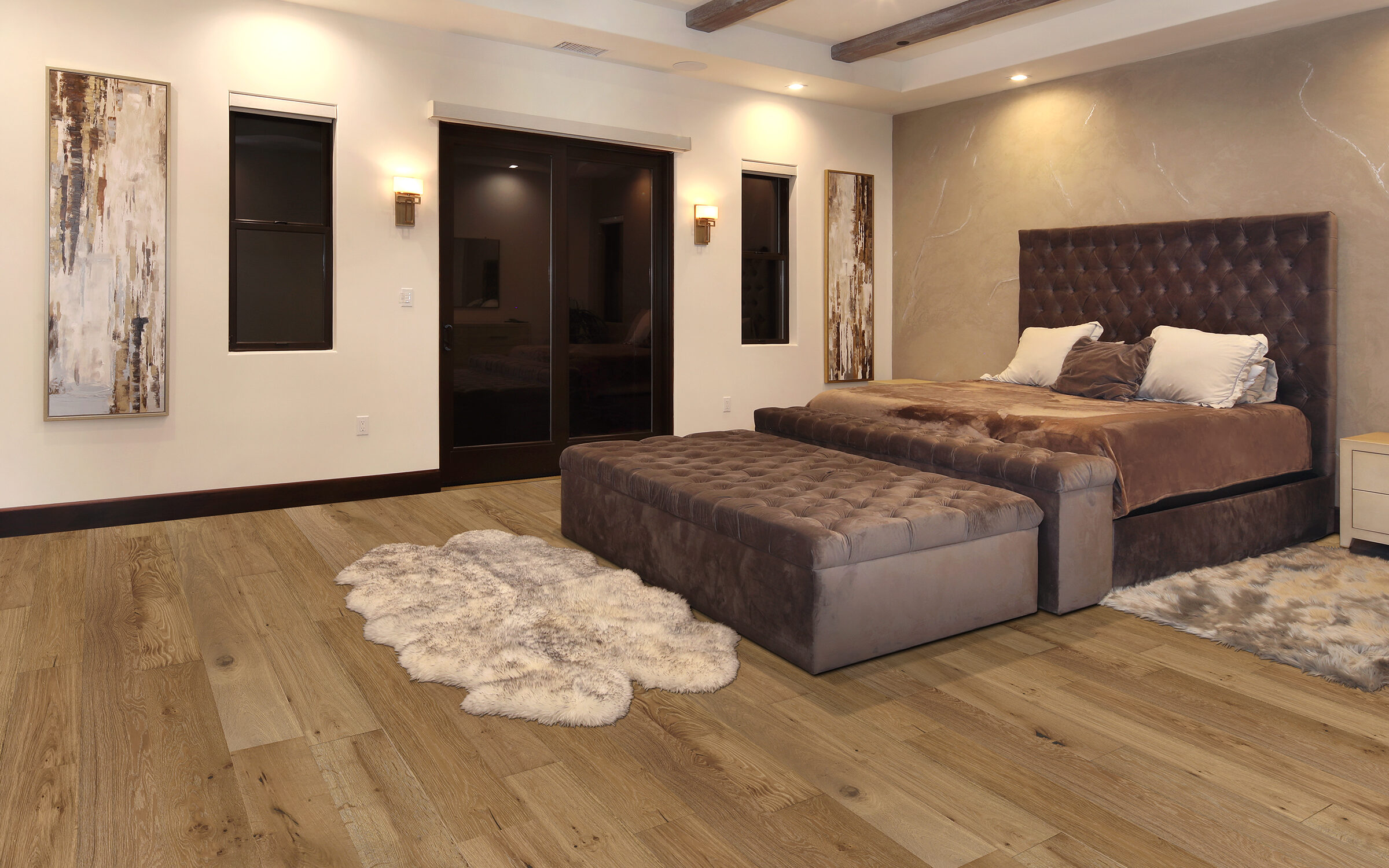 Bedroom featuring Modern Farmhouse pre-finished European Oak flooring, plush bed with tufted headboard, decorative wall art, and cozy area rug.