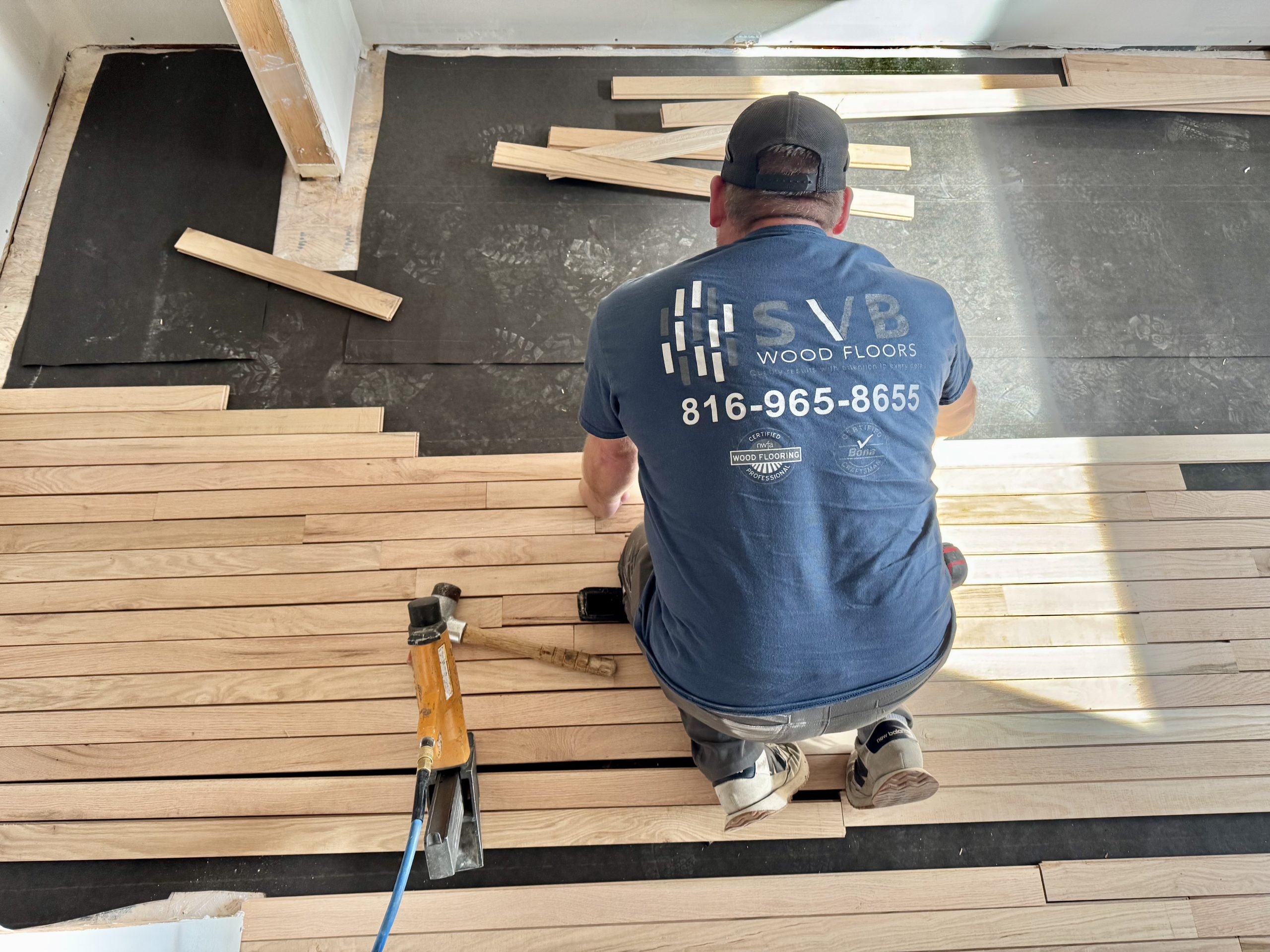 svb wood floor installer installing unfinished hardwood floor in a residential home