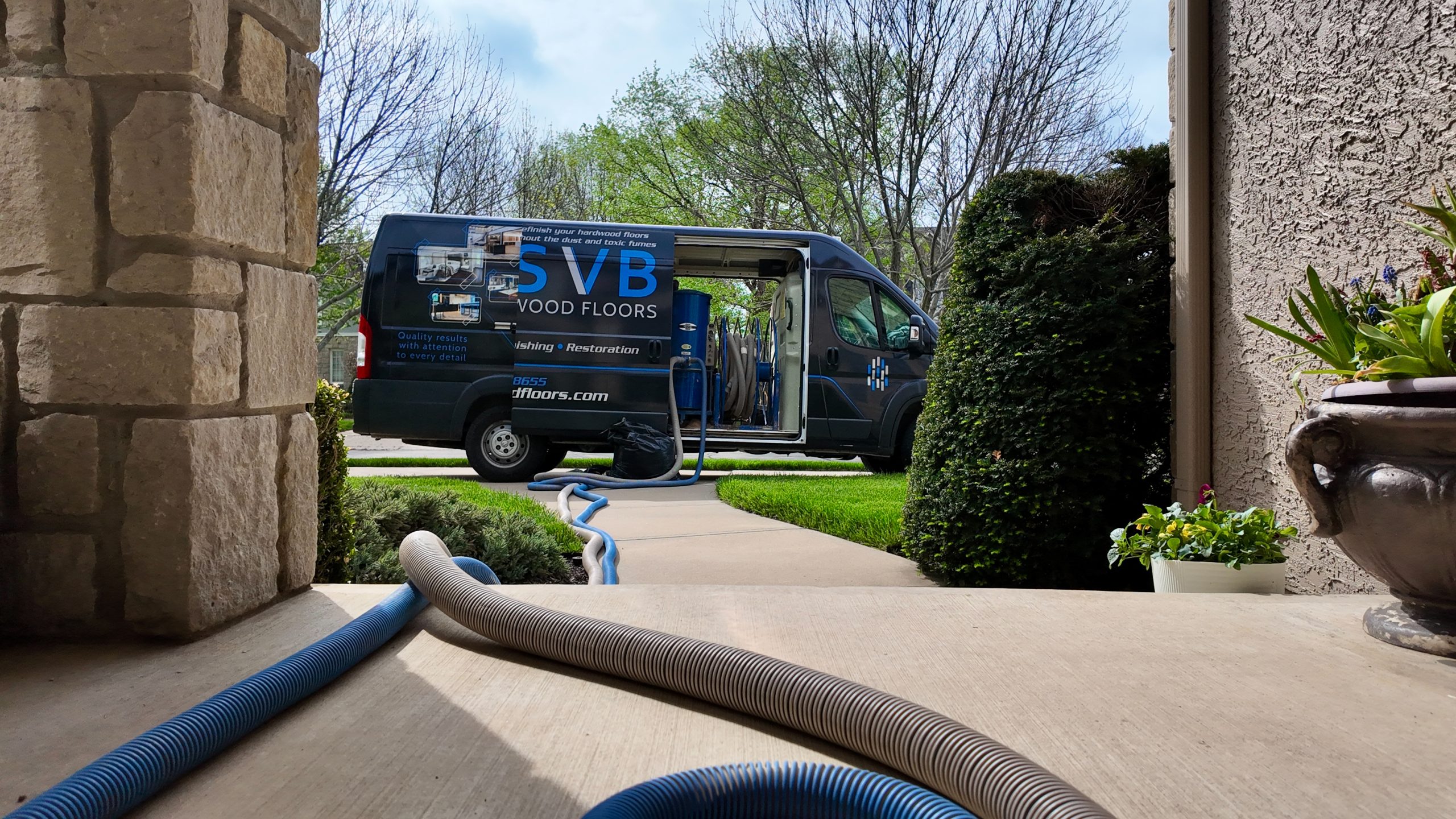 close-up of svb wood floors van showing their dustless refinishing containment system