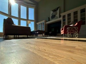 Restored hardwood floors showcasing seamless repairs and refinishing for a like-new appearance.